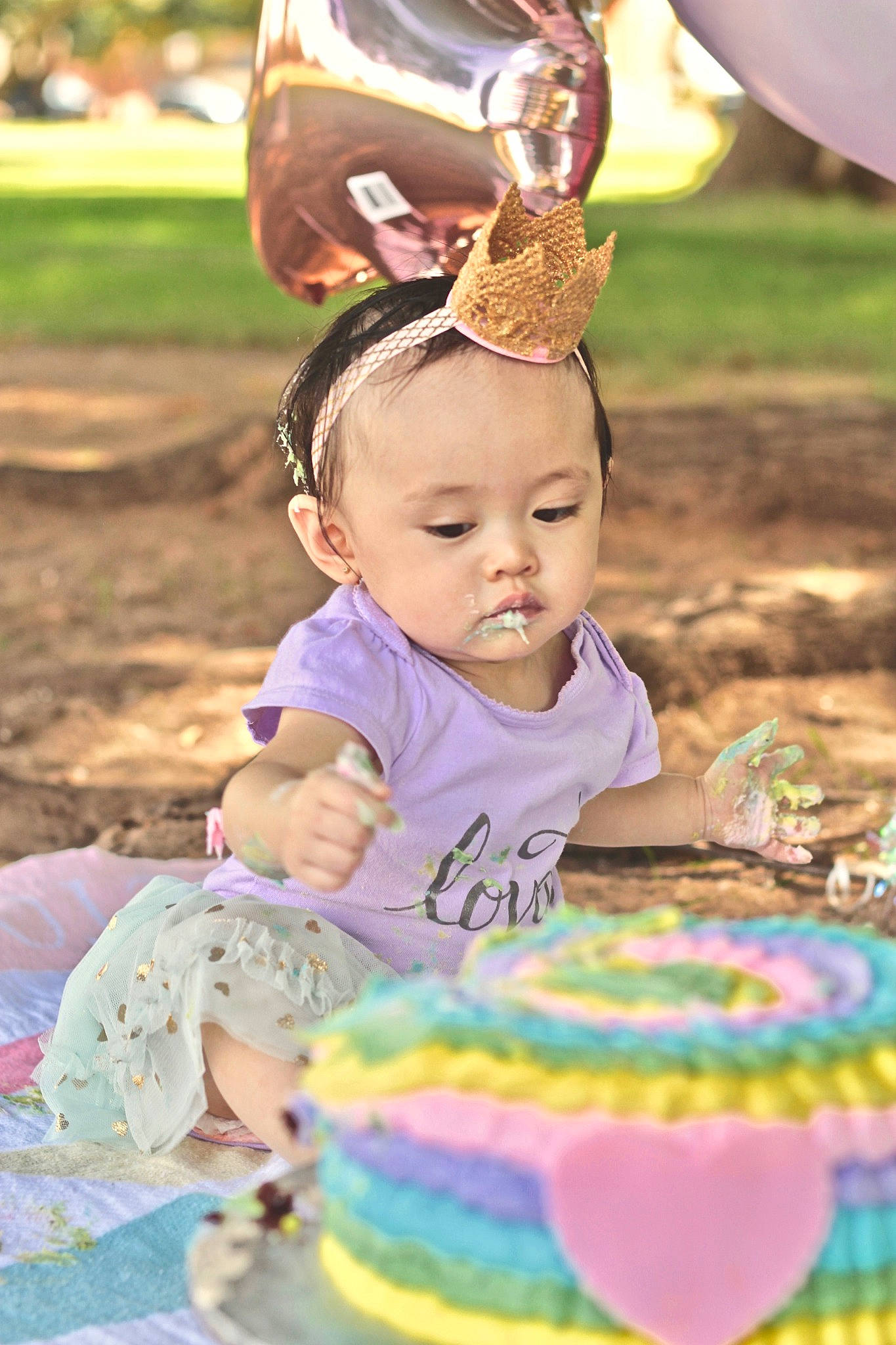 Romani is registered to the contest to win money with this photo: birthday, birthday_cake, cake, cake_decorating, child, hair_accessory, headgear, infant, party_hat, person, product, toddler, torte