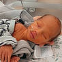 Luca is registered to the contest to win money with this photo: newborn, baby, sleeping, blanket, hospital, nasal_tube, infant, resting, cozy, medical, healthcare, cushion, tags, hand, soft_lighting, wrapped, peaceful, child, person, indoors