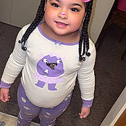 Emely Rose is registered to the contest to win money with this photo: child, pajamas, indoor, smiling, braids, slippers, carpet, tile_floor, door, furniture, filter, pink_ears, nose, cute, happy, person, standing, clothing, young, cozy