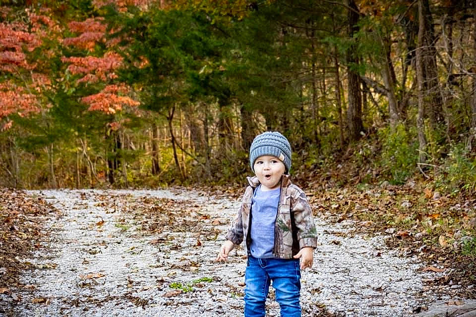 Conrad is registered to the contest to win money with this photo: autumn, child, forest, fun, headwear, leaf, natural_landscape, nature, people_in_nature, person, photograph, photography, plant, portrait, portrait_photography, recreation, toddler, trail, tree, winter