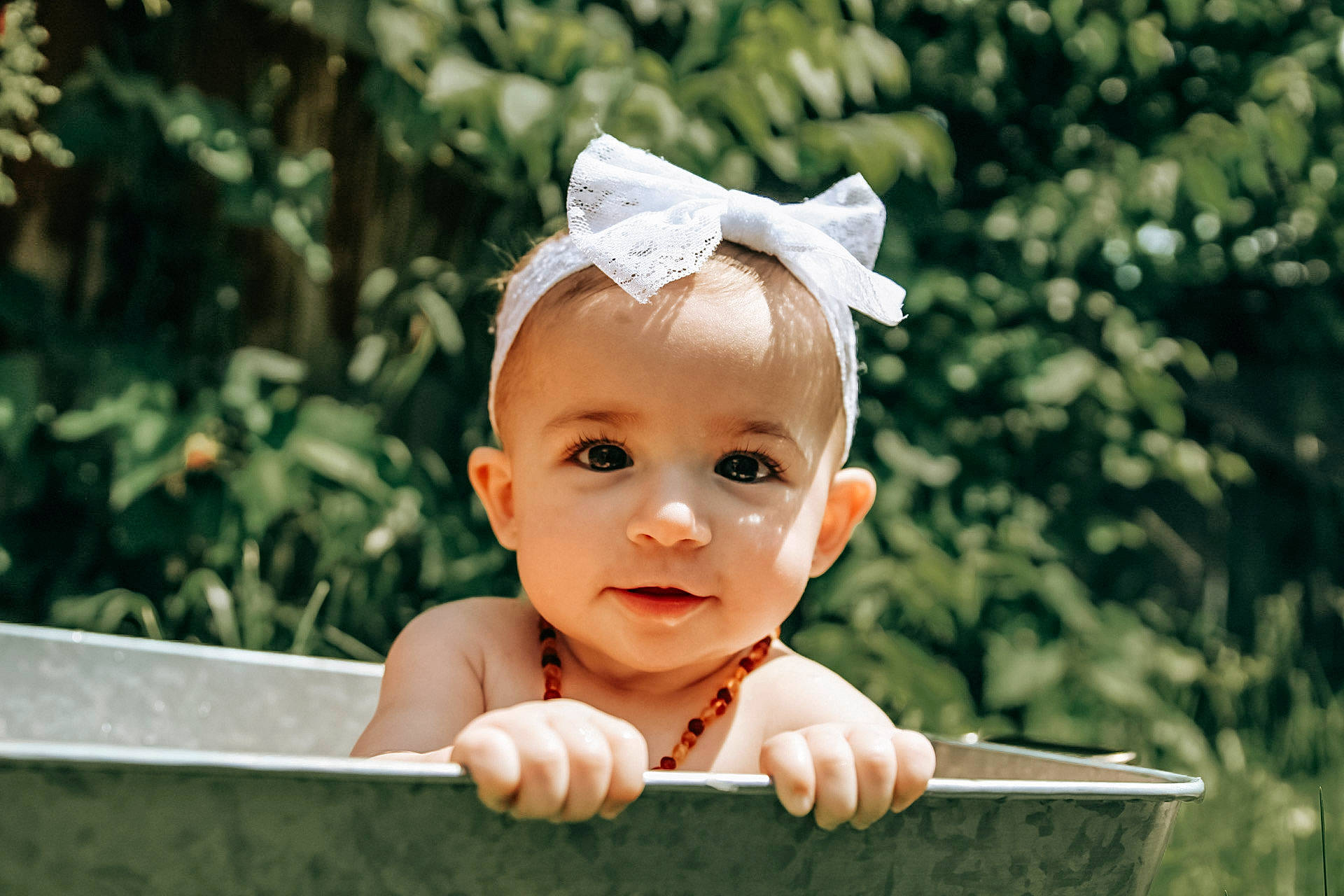 Rayne is registered to the contest to win money with this photo: baby, baby_toddler_clothing, cheek, child, chin, flash_photography, fun, grass, happy, headpiece, laugh, leisure, people_in_nature, person, portrait_photography, sitting, skin, sky, smile, toddler