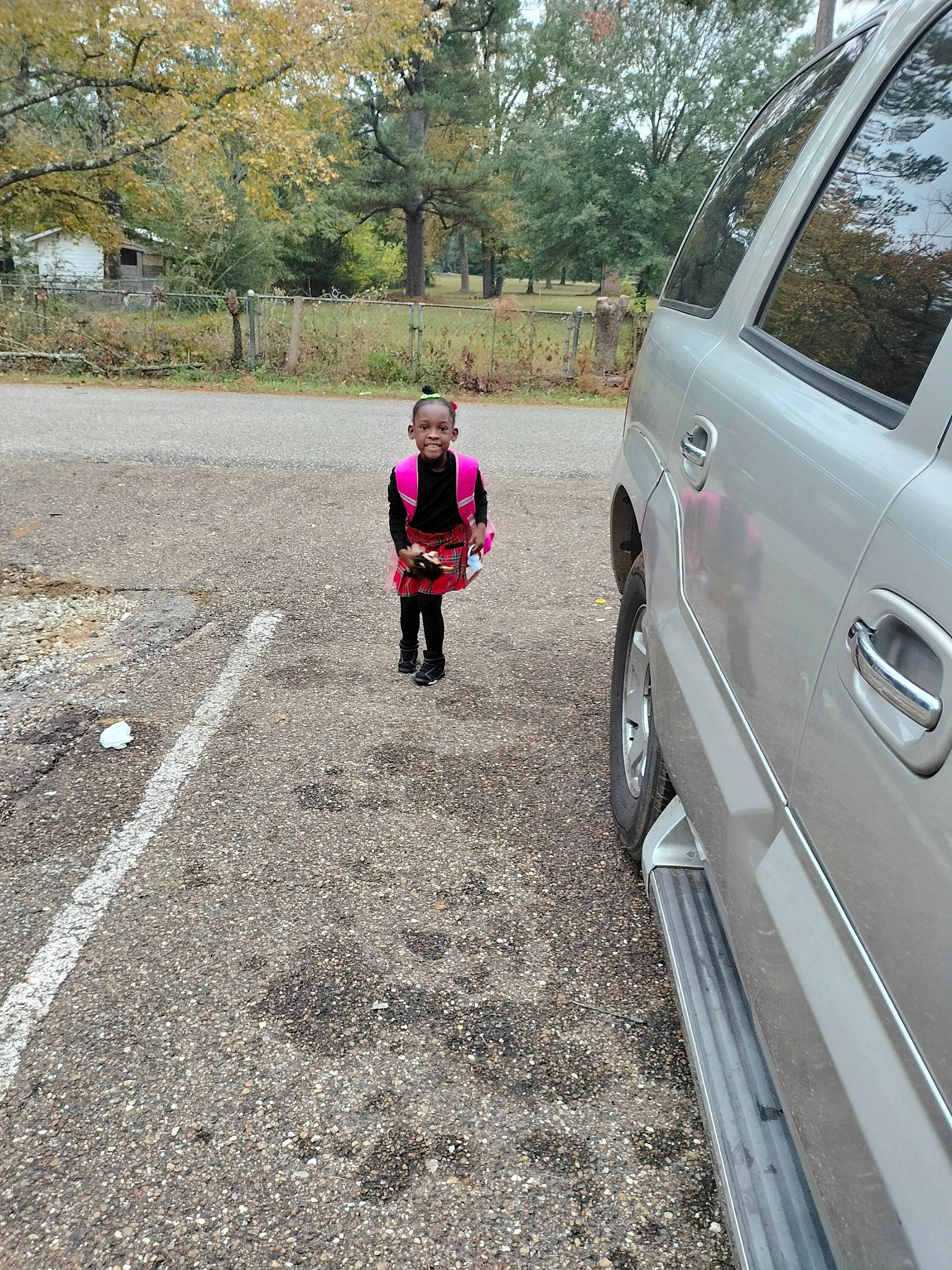 Rhyleigh is registered to the contest to win money with this photo: alloy_wheel, asphalt, automotive_design, automotive_exterior, automotive_lighting, automotive_tire, bumper, car, fender, motor_vehicle, parking, person, plant, road, road_surface, sidewalk, tire, tree, vehicle, vehicle_door