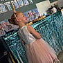 Joyce participe au concours pour gagner de l'argent avec cette photo : child, birthday_party, unicorn_headband, pink_dress, tulle_skirt, smiling, side_view, decorations, frozen_theme, happy_birthday, table, cake, kitchen, poster, celebration, indoors, party, girl, hair_bun, footwear_barefoot