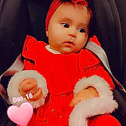 Inaya participe au concours pour gagner de l'argent avec cette photo : baby, baby_products, baby_toddler_clothing, carmine, chair, cheek, child, comfort, doll, facial_expression, fashion_accessory, orange, peach, pink, red, sitting, skin, textile, toddler, toy