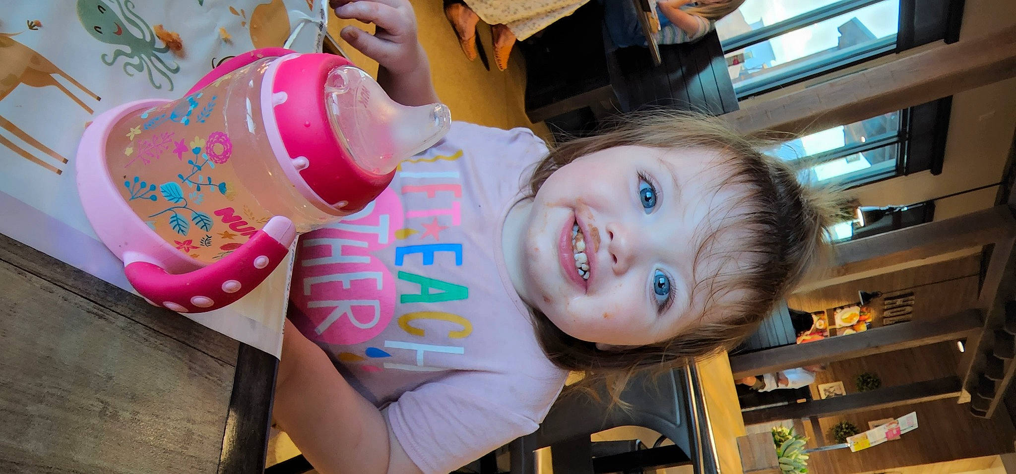 Laken is registered to the contest to win money with this photo: chair, child, drinkware, event, fast_food, fun, happy, joy, leisure, party, party_supply, people, person, plastic_bottle, product, room, shelf, skin, smile, sweetness