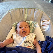 Judah joined the competition — help win amazing prizes! baby, infant, smiling, cushion, blanket, baby_seat, indoor, carpet, furniture, clothing, happy, person, child, blue_blanket, head, face, arm, home, room, seat