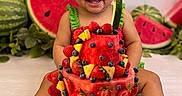 Alisha Roque joined the competition — help win amazing prizes! baby, child, smiling, happy, portrait, watermelon, fruit_cake, strawberries, blueberries, pineapple, fruit, costume, watermelon_hat, cucumber, birthday, celebration, sitting, indoor, colorful, food_photography