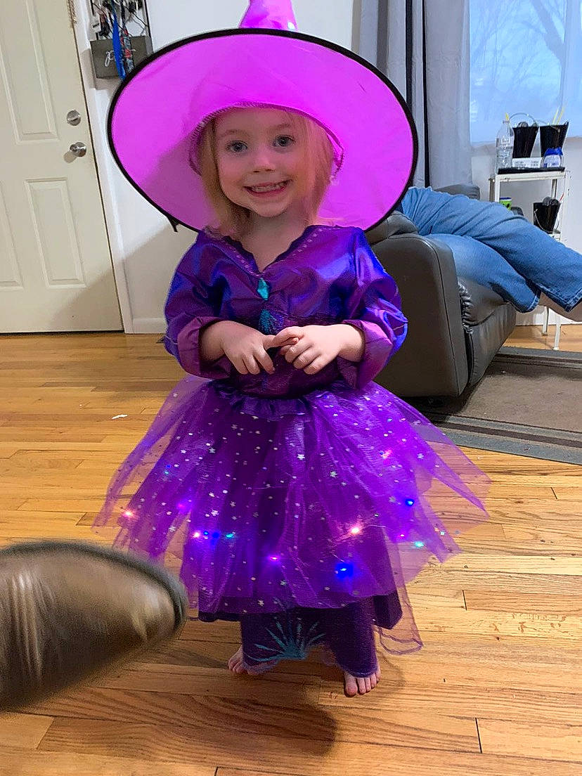 Paisley joined the competition — help win amazing prizes! baby_toddler_clothing, blue, clothing, costume_hat, electric_blue, flooring, fun, happy, hat, headgear, headwear, joy, magenta, person, pink, purple, sleeve, smile, standing, sun_hat