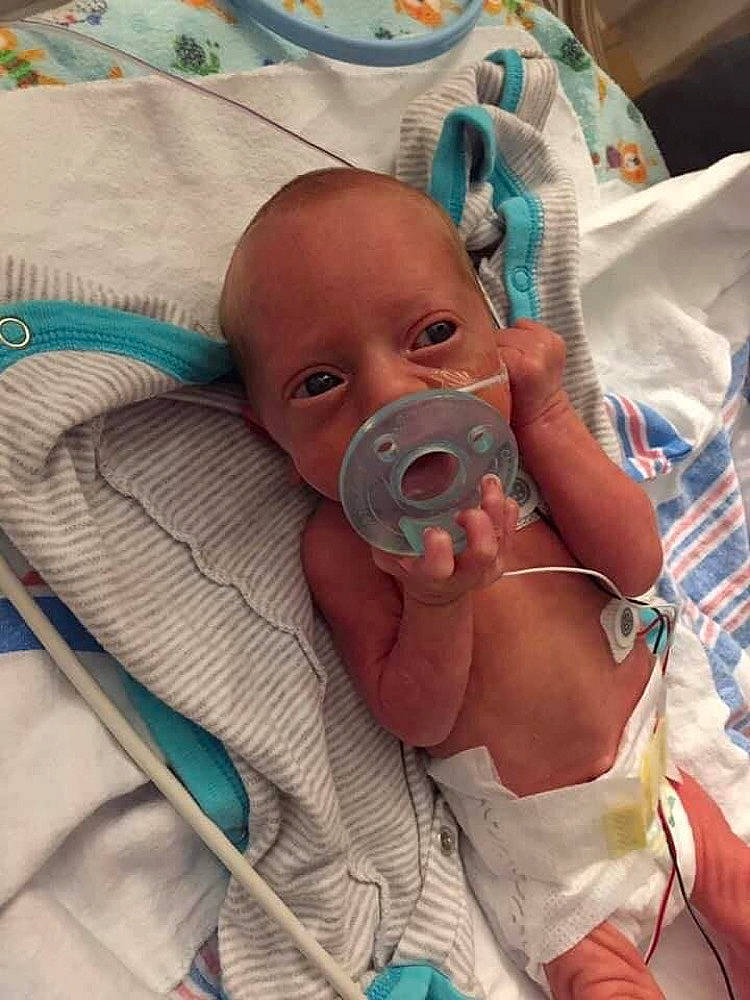 Brycen is registered to the contest to win money with this photo: baby, baby_products, baby_safety, baby_sleeping, baby_toddler_clothing, bedding, child, comfort, event, finger, health_care, hospital, linens, medical, medical_equipment, mouth, pediatrics, person, room, skin