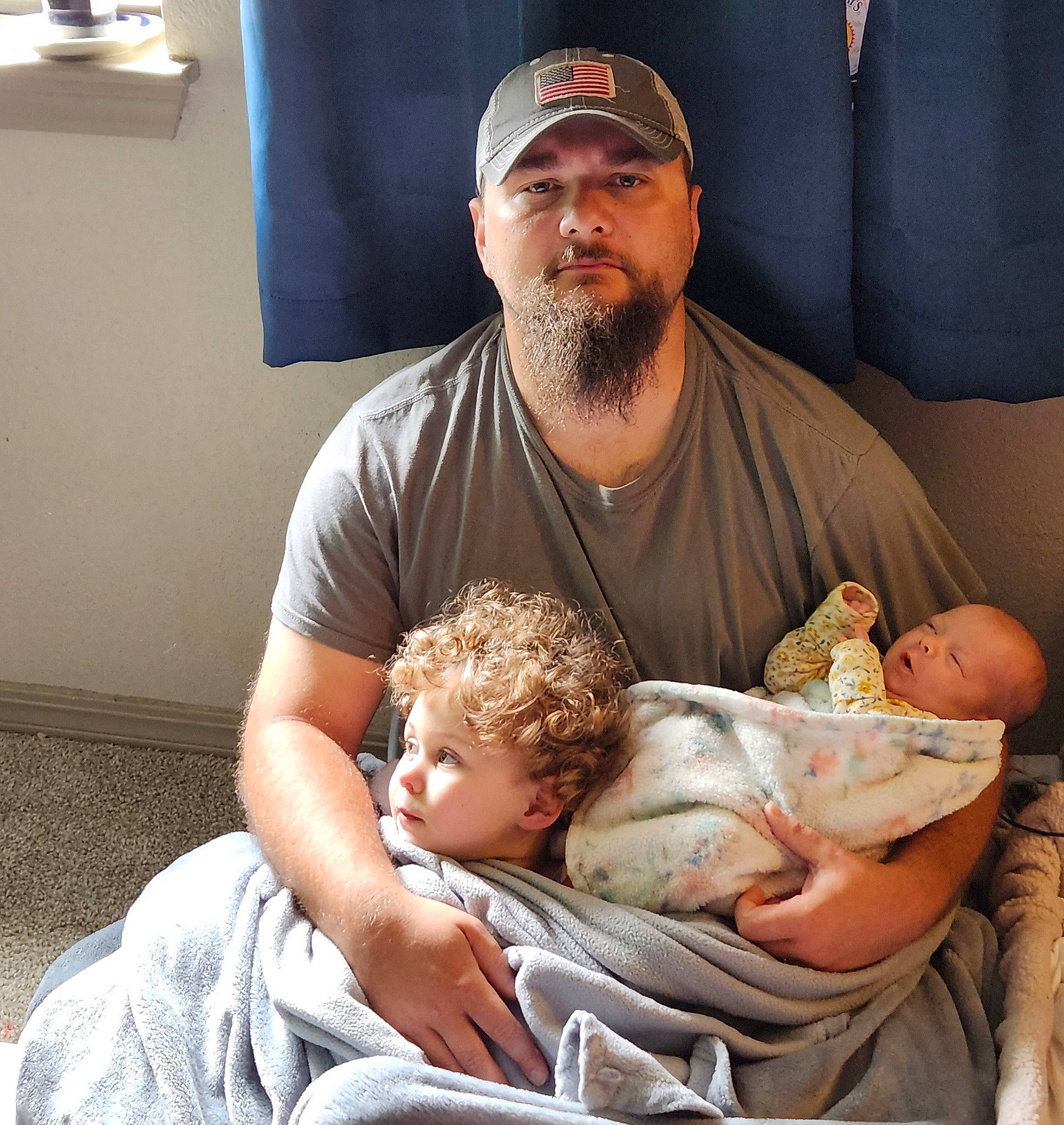 Vivian And Delilah joined the competition — help win amazing prizes! abdomen, baby, baseball_cap, beard, cap, chest, child, comfort, elbow, event, facial_hair, fathers_day, headwear, lap, moustache, muscle, person, room, sitting, toddler