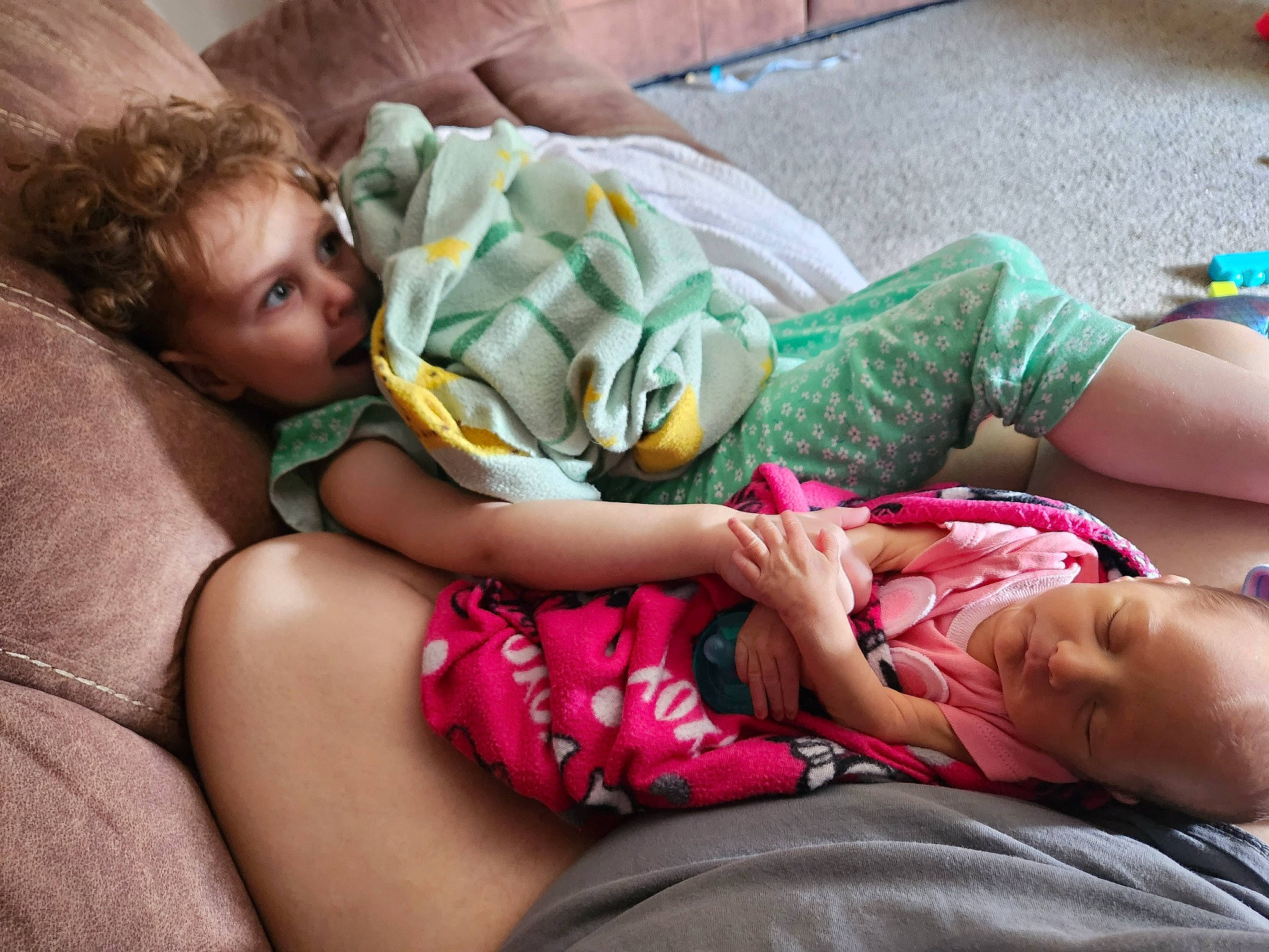 Delilah joined the competition — help win amazing prizes! baby, child, comfort, facial_expression, fun, grass, hairstyle, happy, human, human_leg, joint, lap, leg, leisure, mammal, person, sitting, summer, thigh, toddler