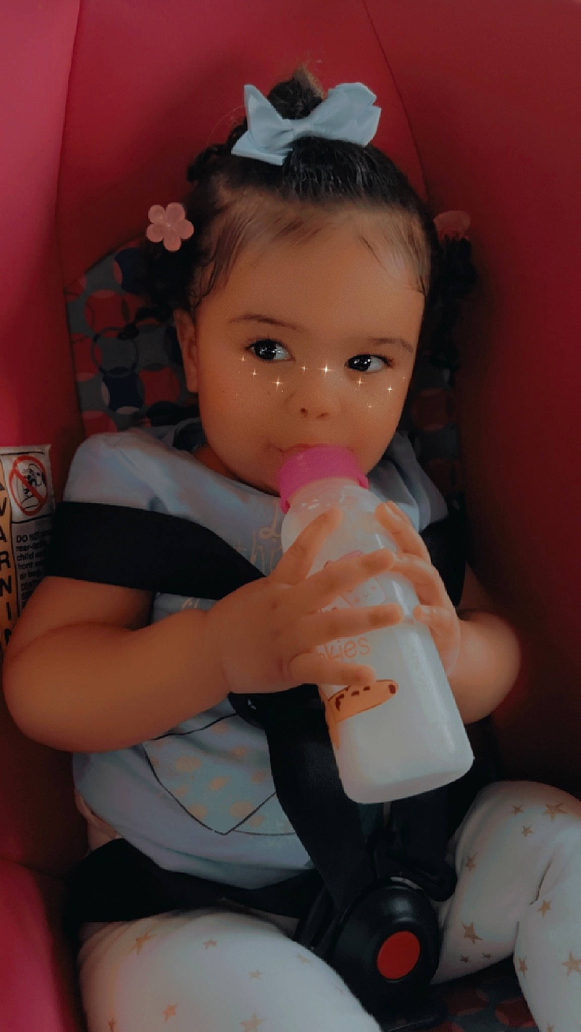 Khloe joined the competition — help win amazing prizes! baby_bottle, baby_products, baby_toddler_clothing, carmine, chair, cheek, child, drinkware, eyelash, happy, human_leg, nail, person, pink, plastic, plastic_bottle, sitting, skin, thigh, thumb