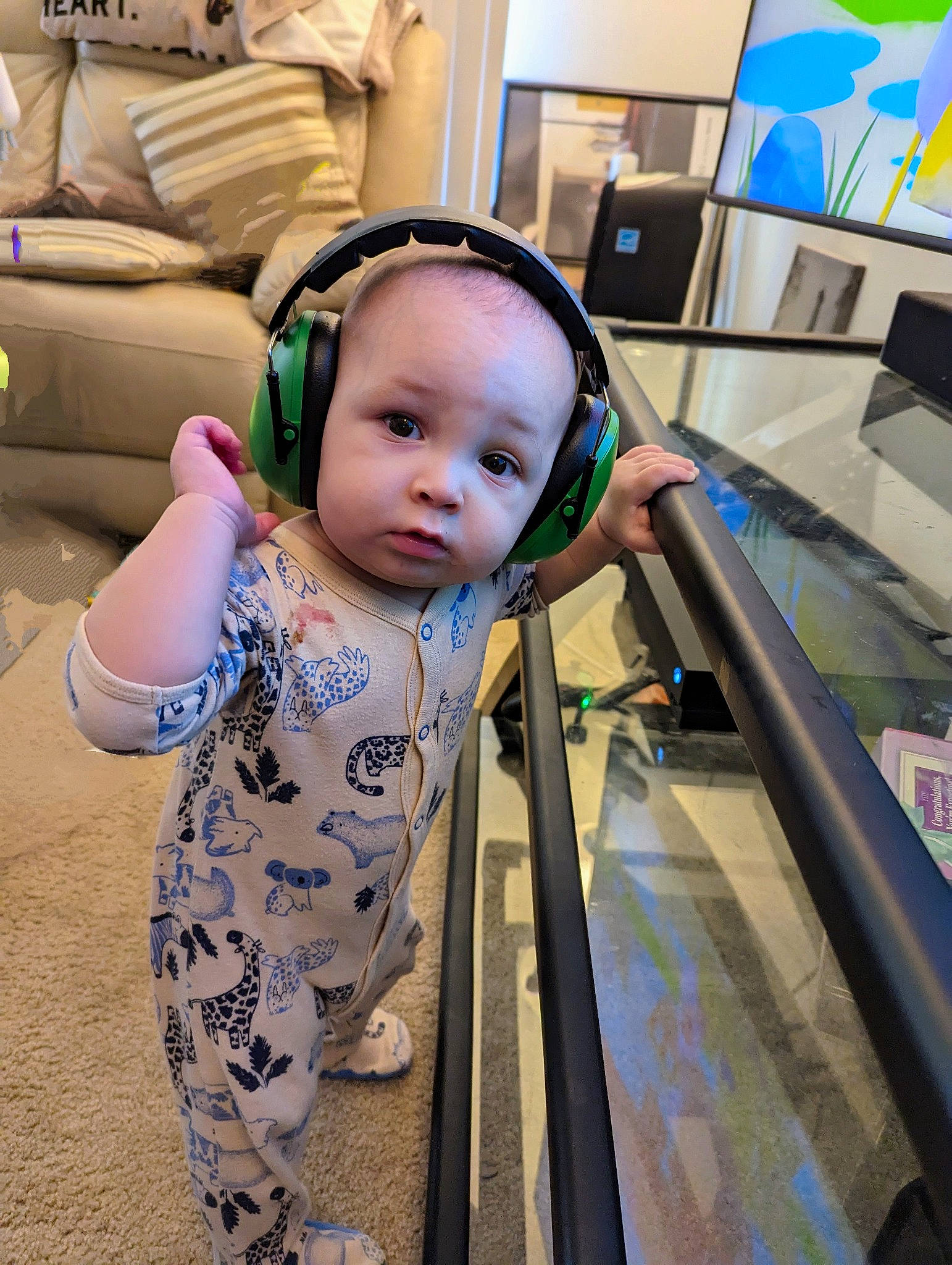 Kristian is registered to the contest to win money with this photo: baby, baby_products, baby_toddler_clothing, child, fashion_accessory, flooring, fun, happy, leisure, person, personal_protective_equipment, recreation, room, sitting, skin, standing, t_shirt, toddler, vacation