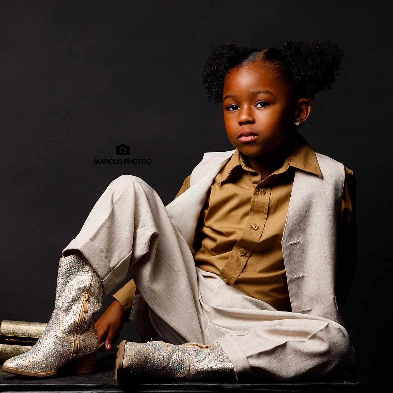 Cree is registered to the contest to win money with this photo: bodypart, boy, child, clothing, coat, face, finger, footwear, formalwear, glove, hand, head, male, person, photography, portrait, shirt, shoe, sitting, suit
