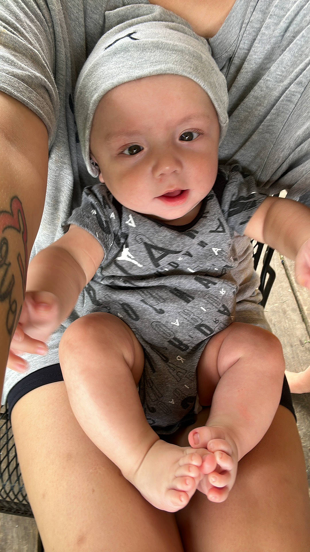Jason joined the competition — help win amazing prizes! baby, baby_toddler_clothing, cap, cheek, child, comfort, eye, finger, fun, hand, happy, headgear, headwear, human_leg, lap, pattern, person, sitting, skin, sleeve