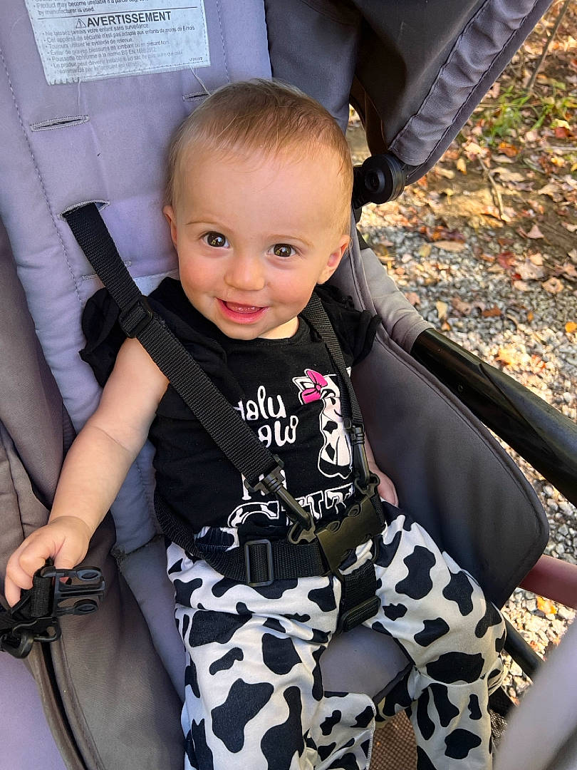 Aurora-jean is registered to the contest to win money with this photo: auto_part, baby, baby_toddler_clothing, chair, child, eye, fashion_accessory, finger, fun, grass, happy, human_leg, joy, lap, pattern, person, sitting, sleeve, smile, thigh