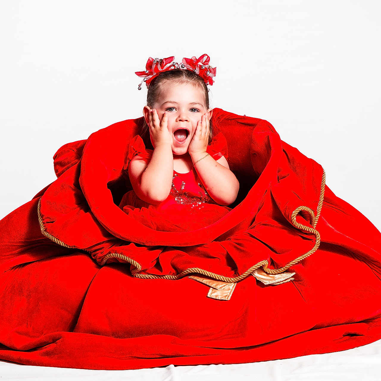 Aulora joined the competition — help win amazing prizes! celebration, child, childhood, cute, expression, fashion, festive, girl, hands_on_face, happy, headband, portrait, posing, red_dress, ribbons, smile, studio, surprised, white_background, young