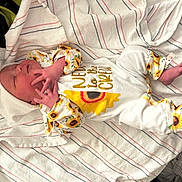 Ryleigh is registered to the contest to win money with this photo: architecture, baby, bed, blanket, bodypart, building, clothing, face, finger, furniture, glove, hand, head, hospital, newborn, person, photography, portrait, quilt, sleeping