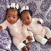 Alayia Alonei joined the competition — help win amazing prizes! baby, twins, infant, pajamas, bow, headband, blanket, purple, pattern, cute, sleepwear, lying_down, toddler, two_children, indoor, soft_texture, comfort, child, adorable, portrait