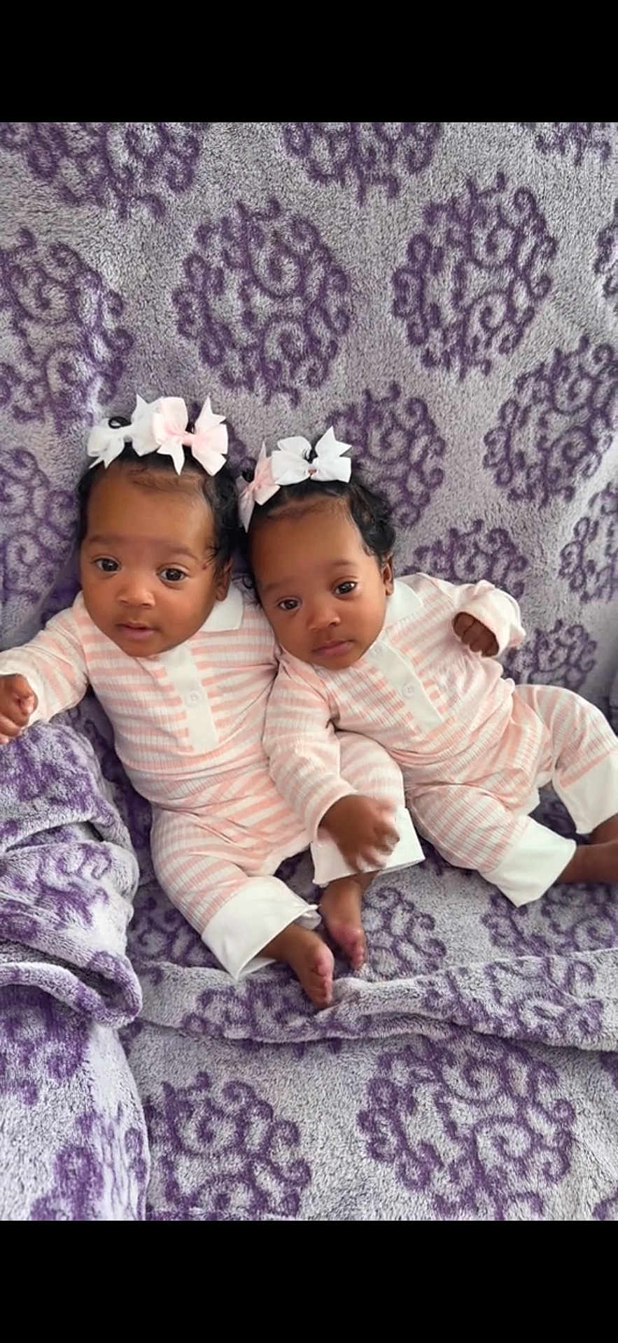 Alayia Alonei joined the competition — help win amazing prizes! baby, twins, infant, pajamas, bow, headband, blanket, purple, pattern, cute, sleepwear, lying_down, toddler, two_children, indoor, soft_texture, comfort, child, adorable, portrait