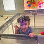 toddler, child, playpen, bubbles, curly_hair, living_room, dog, television, cartoon, floor, window, light, toy, basketball, striped_shirt, person, home, interior, sleeping_dog, happy