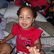 Kynslee joined the competition — help win amazing prizes! toddler, child, red_clothing, smiling, indoor, blanket, pillow, dog, curly_hair, cute, playful, young_child, person, home, casual, sitting, happy, face, hand, cozy