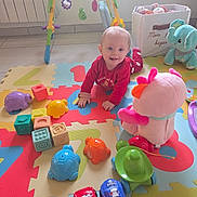 Julia participe au concours pour gagner de l'argent avec cette photo : baby, baby_toy, car_toy, child, childrens_toys, colorful, crawling, early_childhood, floor, foam_mat, happy, indoor, pajamas, plastic_toy, playroom, plush_toy, smiling, stuffed_animal, toy, turtle_toy