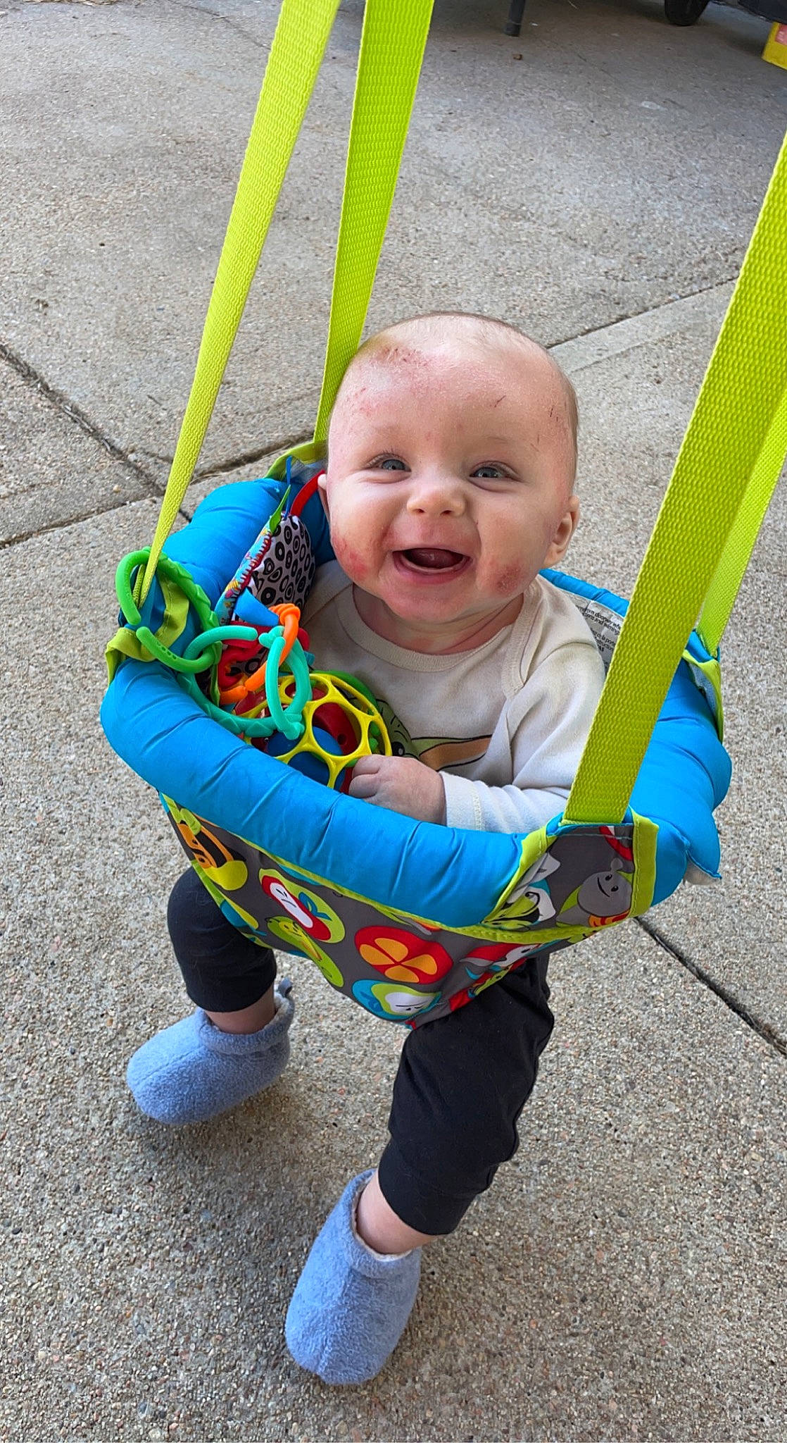 Emmett is registered to the contest to win money with this photo: baby, baby_products, baby_toddler_clothing, child, city, electric_blue, eye, facial_expression, fun, grass, happy, person, photograph, play, sitting, sleeve, smile, swing, toddler, tree