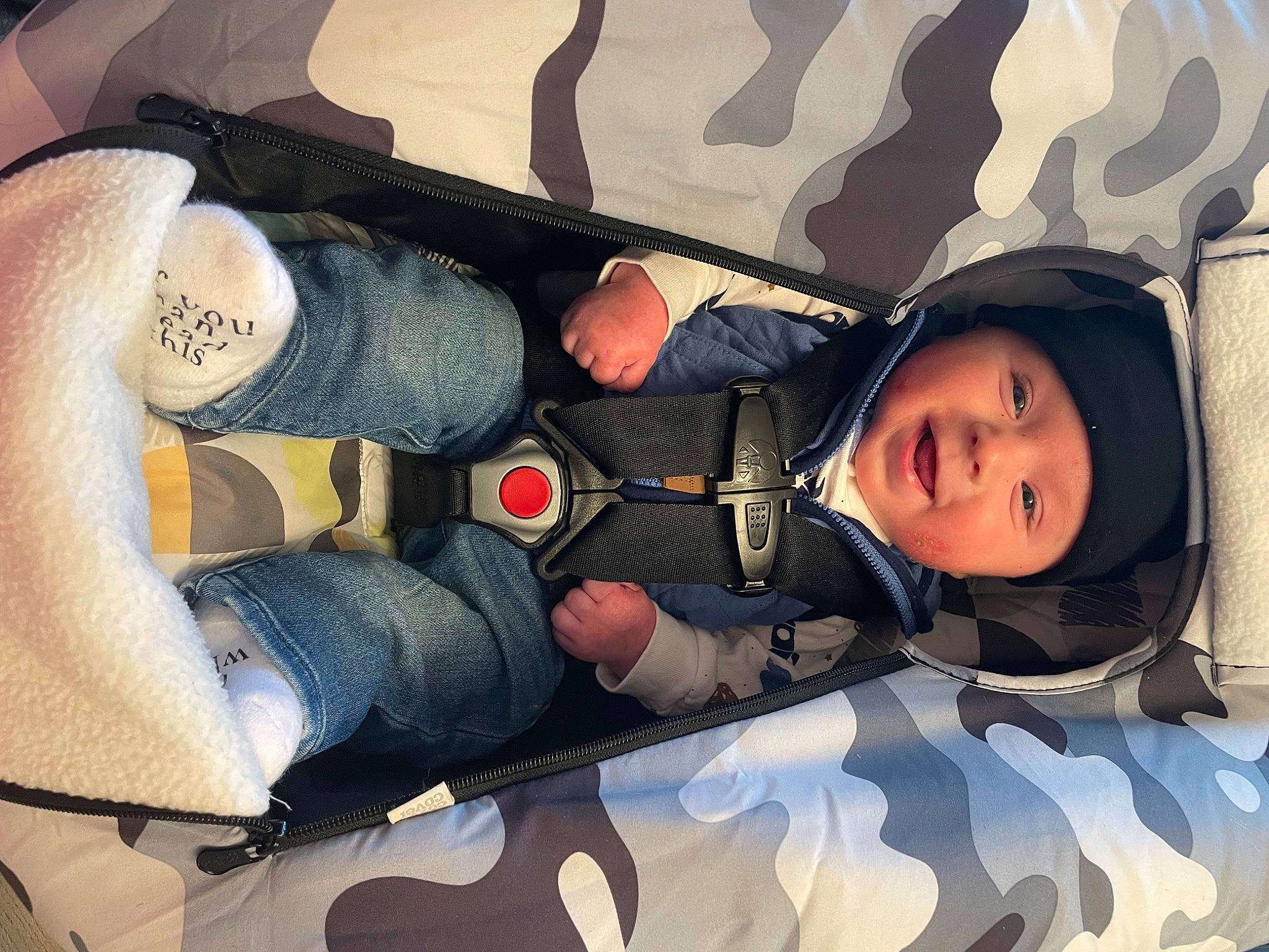 Emmett is registered to the contest to win money with this photo: auto_part, automotive_exterior, baby, baby_carriage, baby_products, bag, car_seat, child, comfort, family_car, headwear, human_leg, luggage_and_bags, motor_vehicle, person, personal_luxury_car, sitting, steering_wheel, thigh, toddler