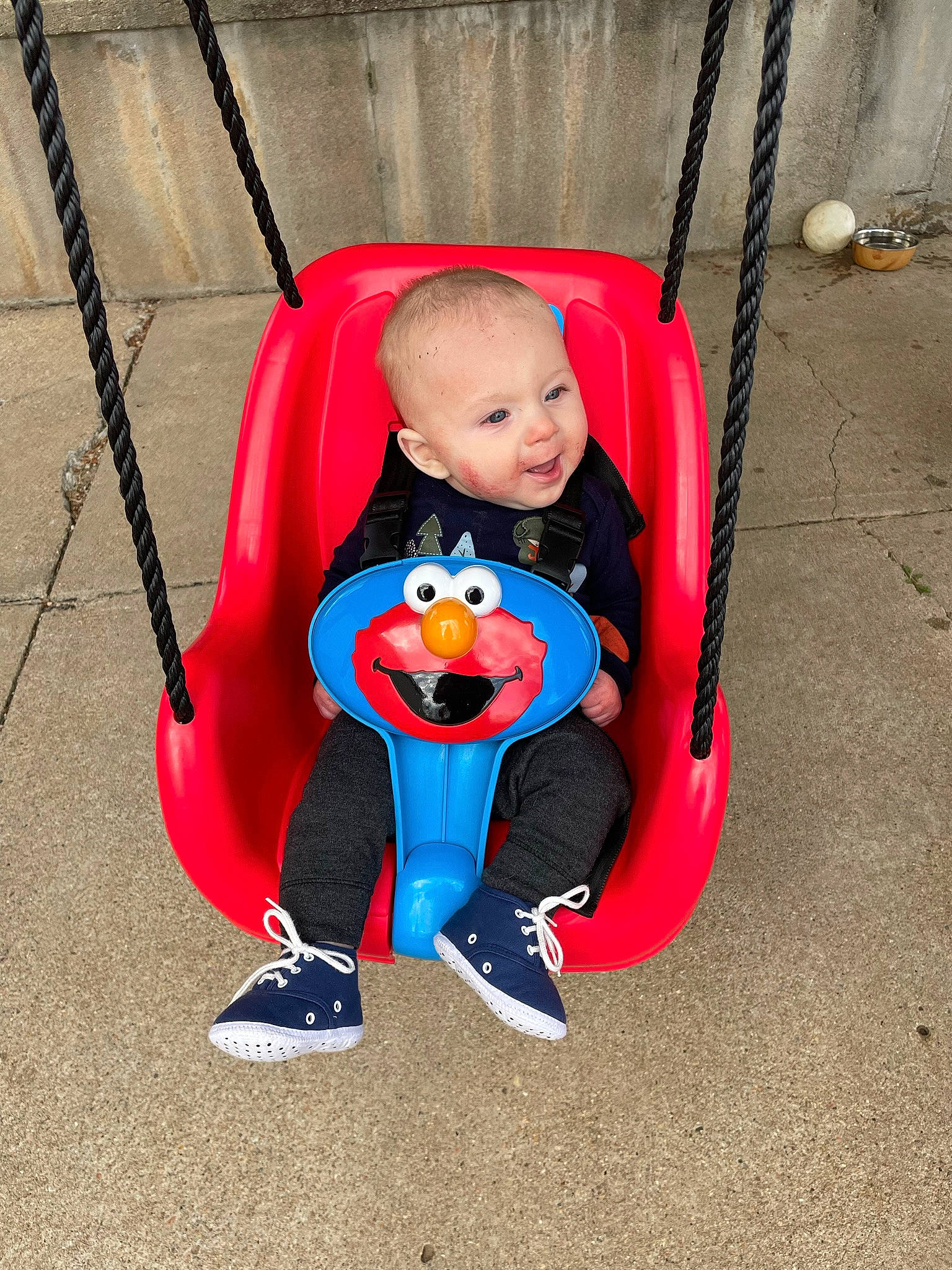 Emmett is registered to the contest to win money with this photo: baby, baby_carriage, baby_products, baby_toddler_clothing, chair, city, comfort, electric_blue, face, fun, grass, happy, leisure, outdoor_play_equipment, person, plant, recreation, sitting, smile, toddler