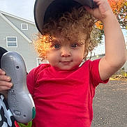 P.j joined the competition — help win amazing prizes! child, toddler, curly_hair, red_shirt, cap, toy, outdoor, daylight, house, tree, autumn, playful, person, face, hand, expression, street, casual_clothing, nature, holding