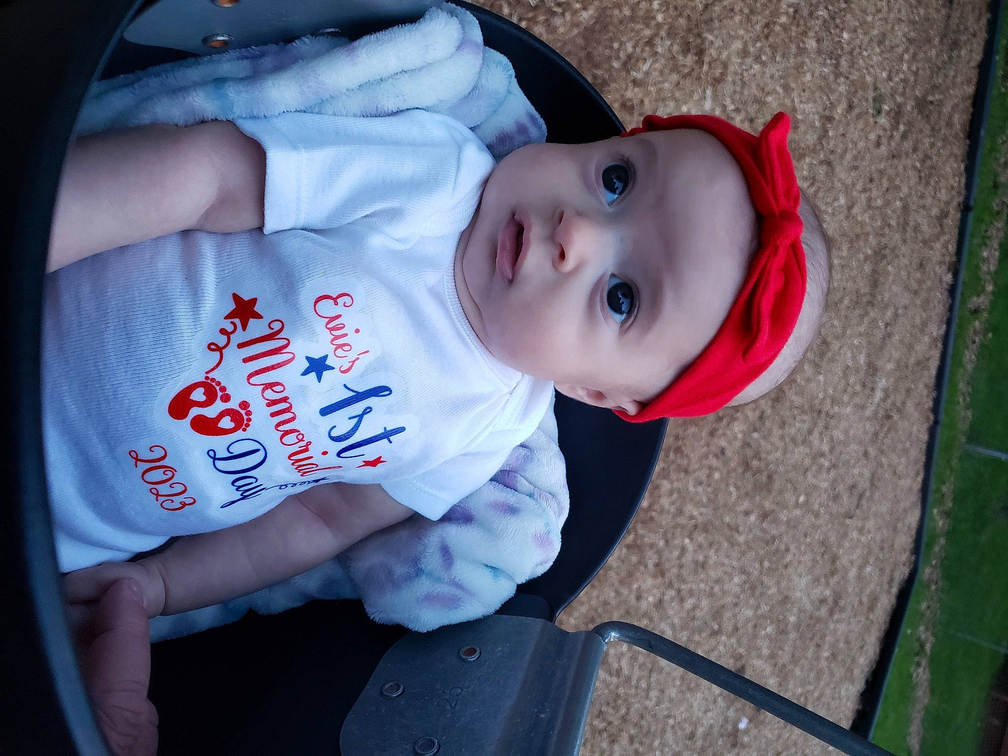 Evie is registered to the contest to win money with this photo: baby, baby_products, baby_toddler_clothing, carmine, cheek, child, chin, elbow, electric_blue, eye, fun, grass, hat, headwear, lip, mouth, nose, person, sleeve, smile