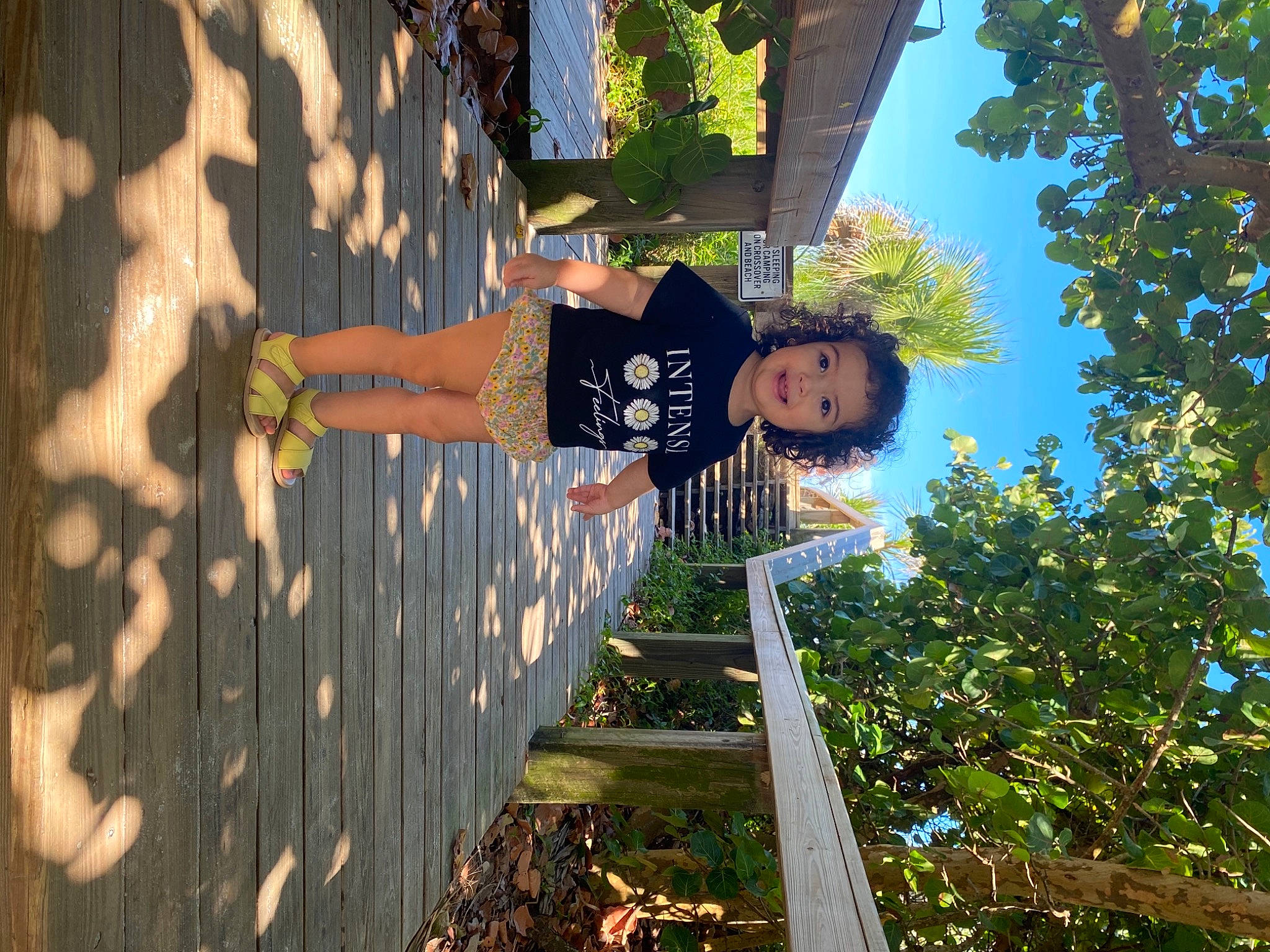 Ainhoa is registered to the contest to win money with this photo: branch, child, facade, fun, grass, happy, human_leg, joy, leisure, people_in_nature, person, plant, reflection, shadow, sky, sunlight, tints_and_shades, toddler, tree, visual_arts