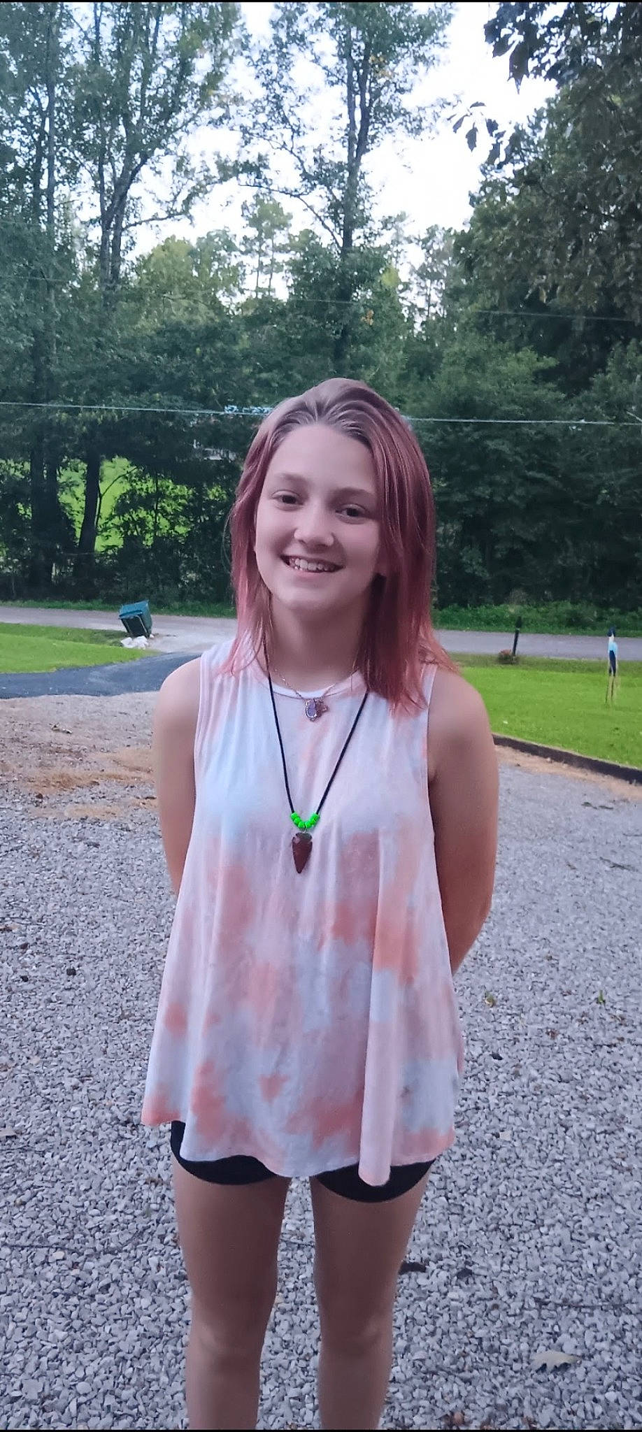 Ainsley is registered to the contest to win money with this photo: asphalt, electric_blue, eyewear, fun, grass, hair, happy, jewellery, joy, leisure, long_hair, necklace, person, pink, plant, recreation, sleeve, smile, t_shirt, tree