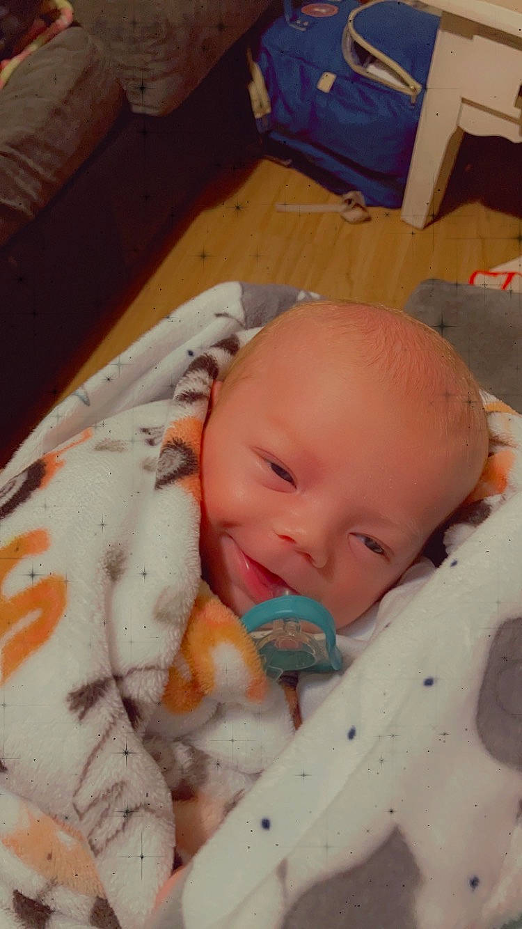 Degan is registered to the contest to win money with this photo: baby, baby_products, baby_toddler_clothing, bedtime, box, carton, cheek, child, chin, comfort, head, iris, linens, nose, person, room, shipping_box, skin, sleep, thumb