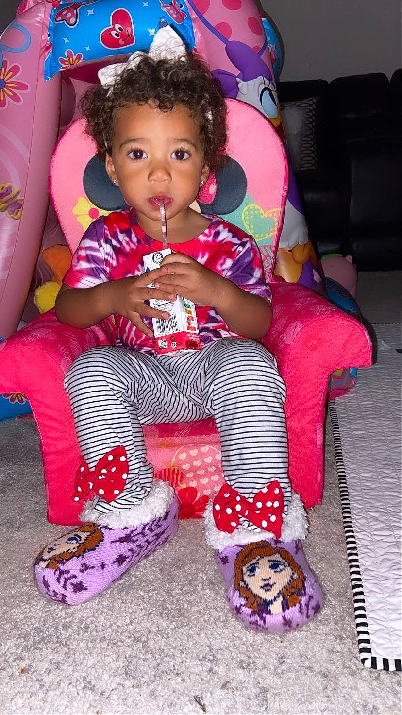 Arielle joined the competition — help win amazing prizes! baby_toddler_clothing, carmine, child, event, face, fun, happy, holiday, lap, magenta, pattern, person, pink, purple, sitting, sleeve, snapshot, sneakers, sock, toddler