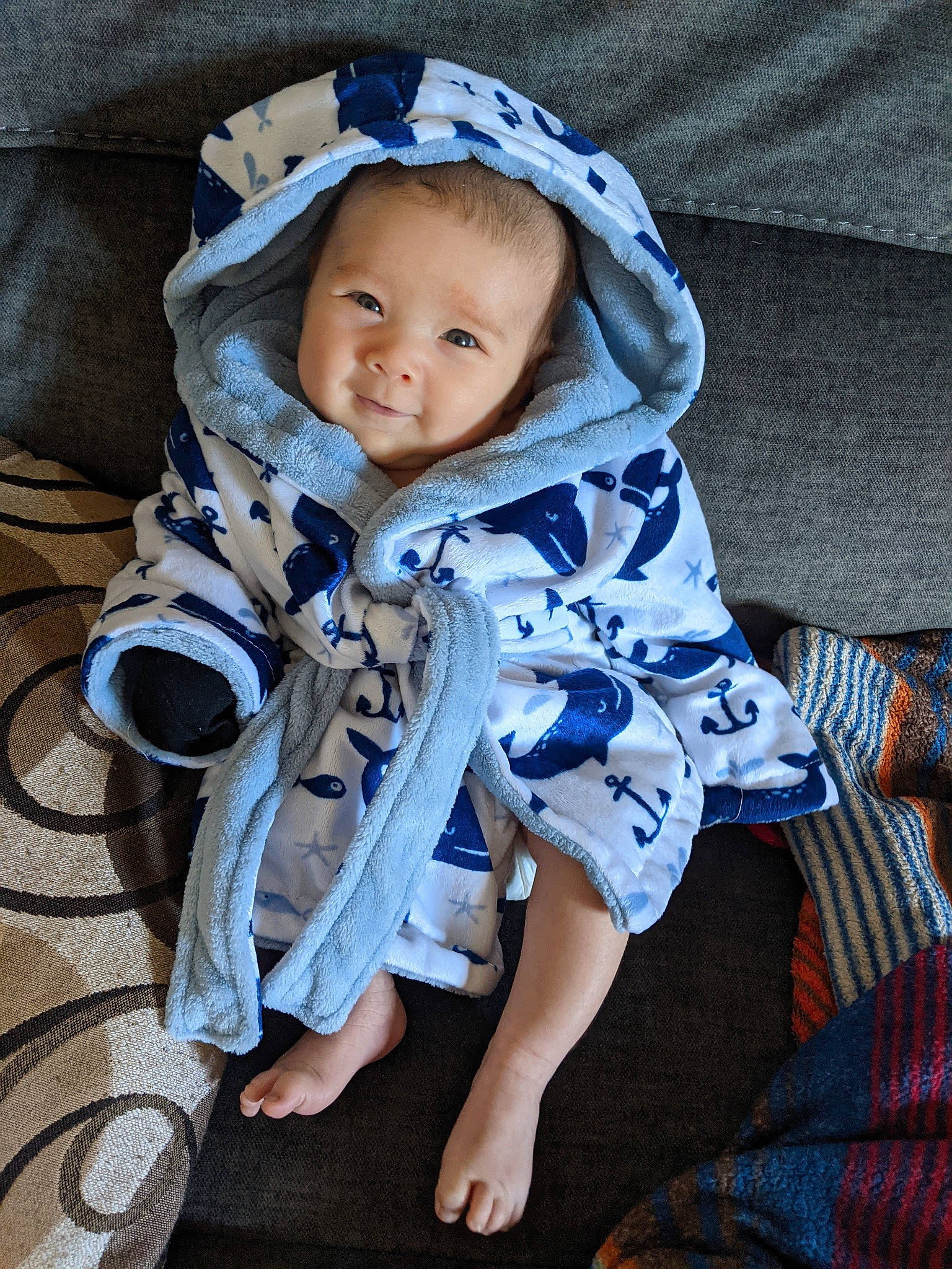 Graham joined the competition — help win amazing prizes! baby, baby_products, baby_toddler_clothing, beanie, cap, child, comfort, electric_blue, eye, fashion_accessory, fun, grass, happy, linens, pattern, person, portrait_photography, sitting, sleeve, smile