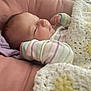 Isla is registered to the contest to win money with this photo: baby, sleeping, blanket, crochet, pastel_colors, cushion, infant, cozy, soft, sleep, cute, child, resting, comfort, peaceful, indoors, portrait, closeup, clothing, head