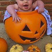 Nevaeh joined the competition — help win amazing prizes! baby, pumpkin, jack_o_lantern, smiling, drool, five_months, blanket, brick_wall, fall_decor, cute, infant, orange, decorative_pumpkins, happy, child, outdoor, seasonal, autumn, holiday, playful
