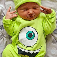 Noah participe au concours pour gagner de l'argent avec cette photo : baby, newborn, sleeping, onesie, hat, green_clothing, mike_wazowski, character_print, polka_dot_blanket, infant, cute, child, soft_fabric, lying_down, peaceful, closed_eyes, small_hands, portrait, indoor, cozy