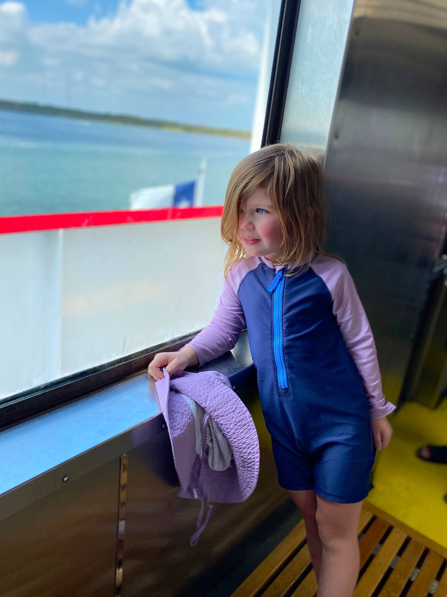 Guinevere joined the competition — help win amazing prizes! azure, baby_toddler_clothing, blond, child, city, cloud, electric_blue, fun, happy, lake, leisure, ocean, person, recreation, reflection, sky, standing, summer, toddler, travel