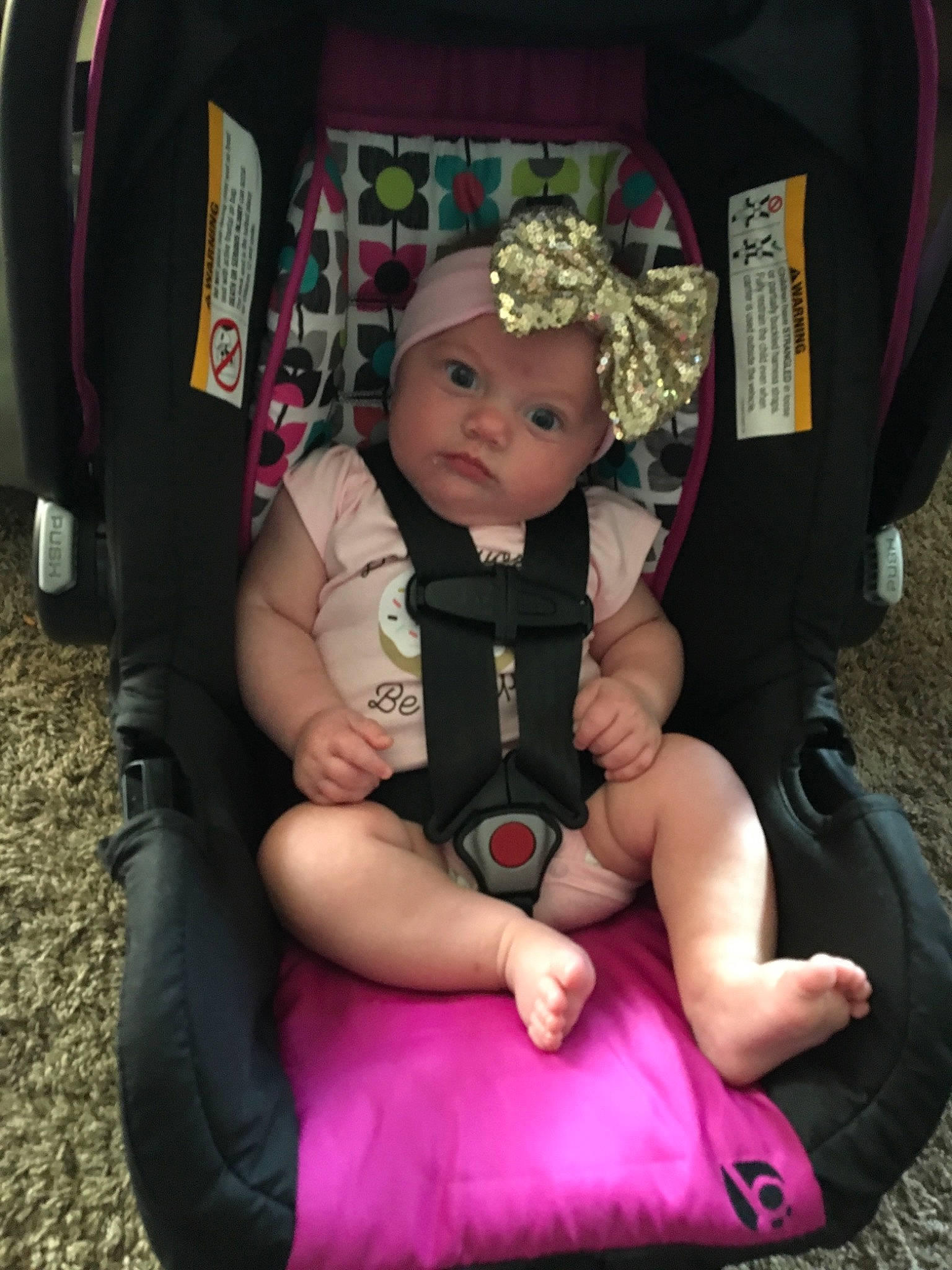 Coraline joined the competition — help win amazing prizes! baby, baby_carriage, baby_carrier, baby_in_car_seat, baby_products, car_seat, child, comfort, fun, furniture, headwear, lap, person, pink, play, product, sitting, smile, toddler