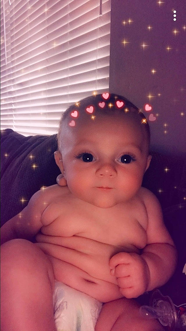 Coraline is registered to the contest to win money with this photo: baby, cheek, chest, child, chin, eye, eyebrow, face, forehead, fun, head, iris, lip, mouth, muscle, nose, organ, person, skin, smile