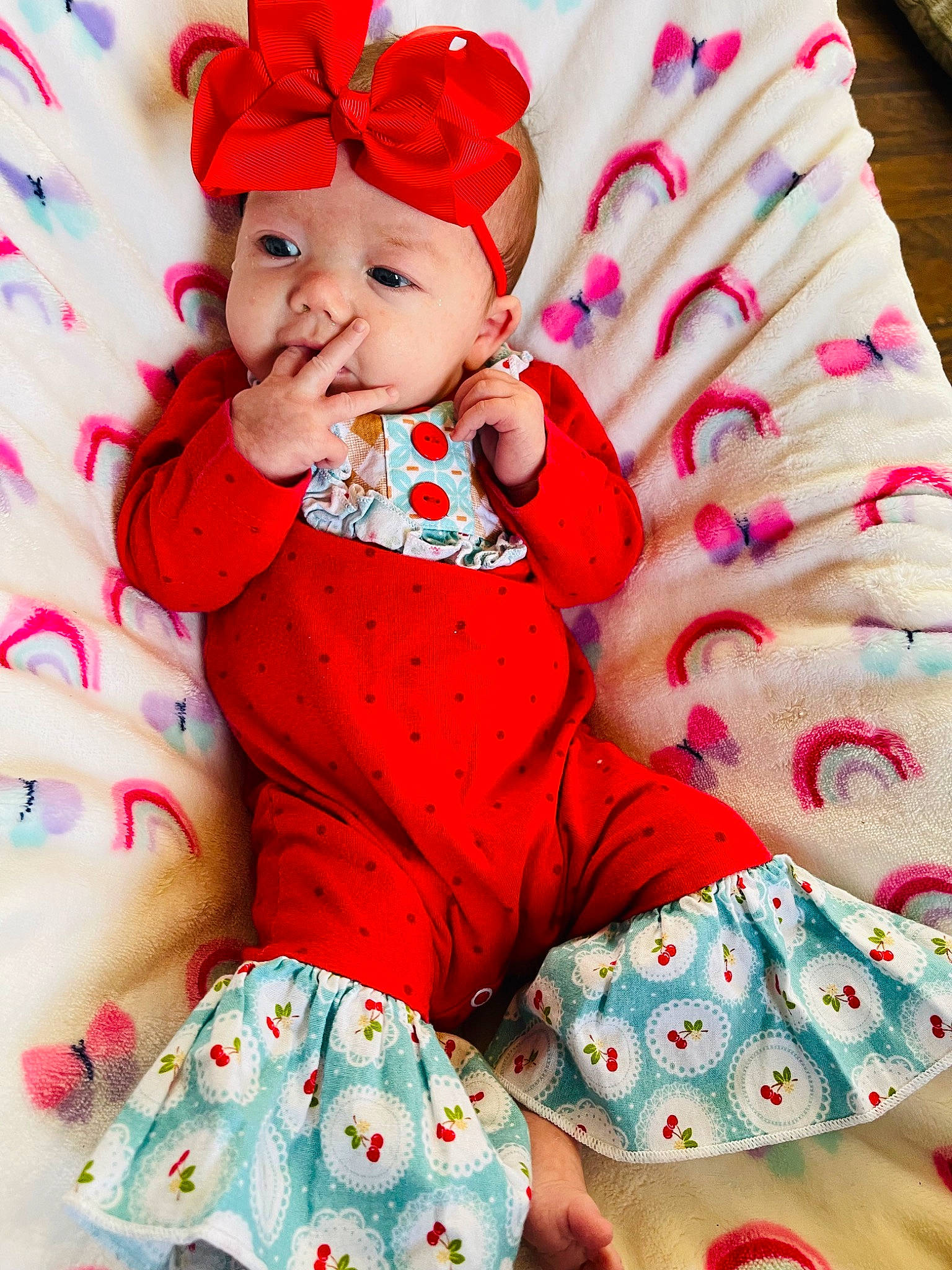 Rayanna joined the competition — help win amazing prizes! arm, baby, baby_toddler_clothing, child, comfort, event, face, fictional_character, happy, hat, headwear, magenta, pattern, person, pink, product, red, skin, sleeve, smile
