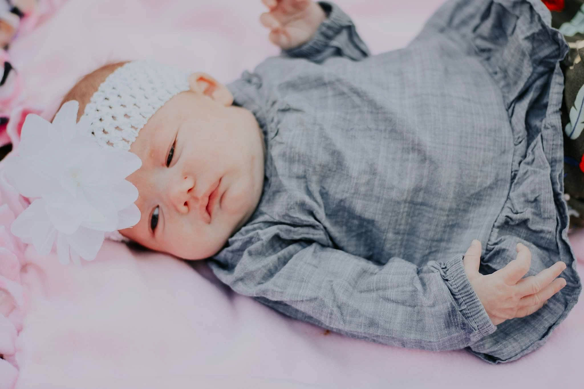 Rayanna joined the competition — help win amazing prizes! baby, baby_sleeping, baby_toddler_clothing, beanie, bedding, bedtime, child, comfort, eyelash, fur, grass, happy, hat, headwear, knit_cap, linens, nap, person, sitting, sleep
