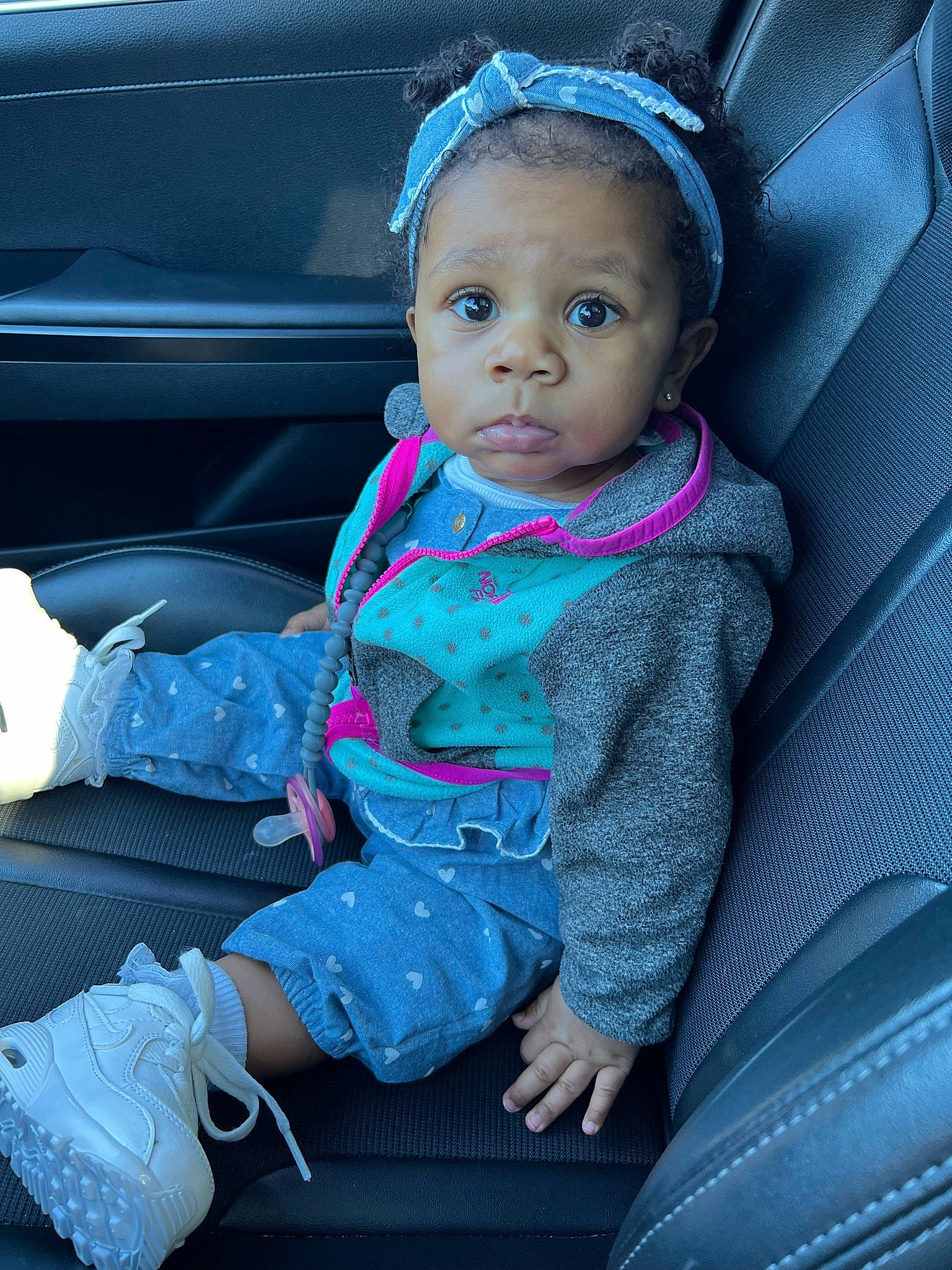 Demi is registered to the contest to win money with this photo: auto_part, automotive_exterior, baby, baby_carriage, baby_products, baby_toddler_clothing, car_seat, car_seat_cover, child, comfort, electric_blue, family_car, motor_vehicle, outerwear, person, product, purple, sitting, tints_and_shades, toddler