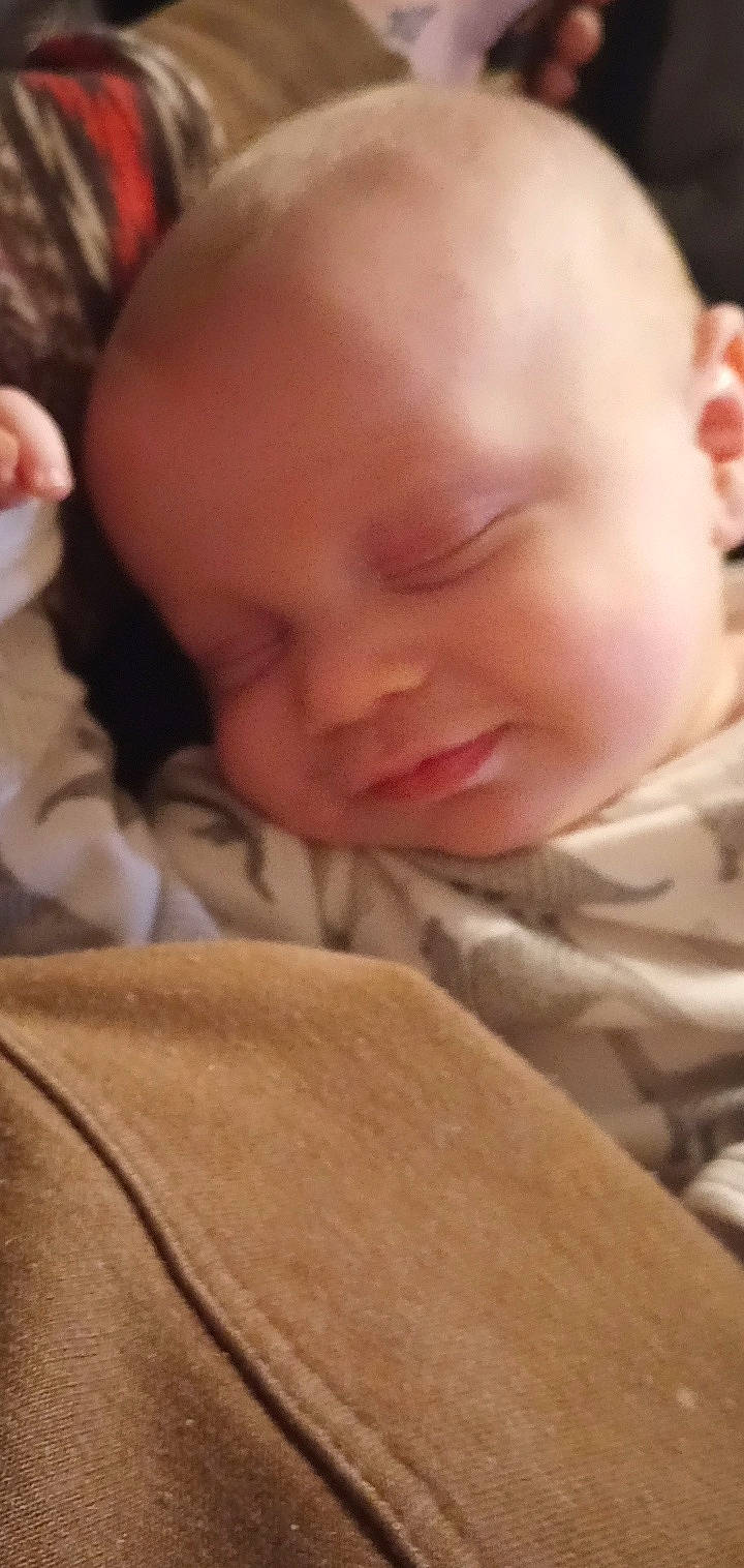 Everett is registered to the contest to win money with this photo: baby, baby_toddler_clothing, cheek, child, chin, comfort, eye, eyebrow, finger, forehead, hand, iris, lip, mouth, neck, nose, person, skin, sleeve, toddler