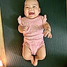 Haylen joined the competition — help win amazing prizes! baby, bare_feet, cheerful, child, cute, floor, happy, human, indoor, infant, lemon_prints, lying_down, mat, person, pink_onesie, playful, portrait, skin, small_hands, smiling