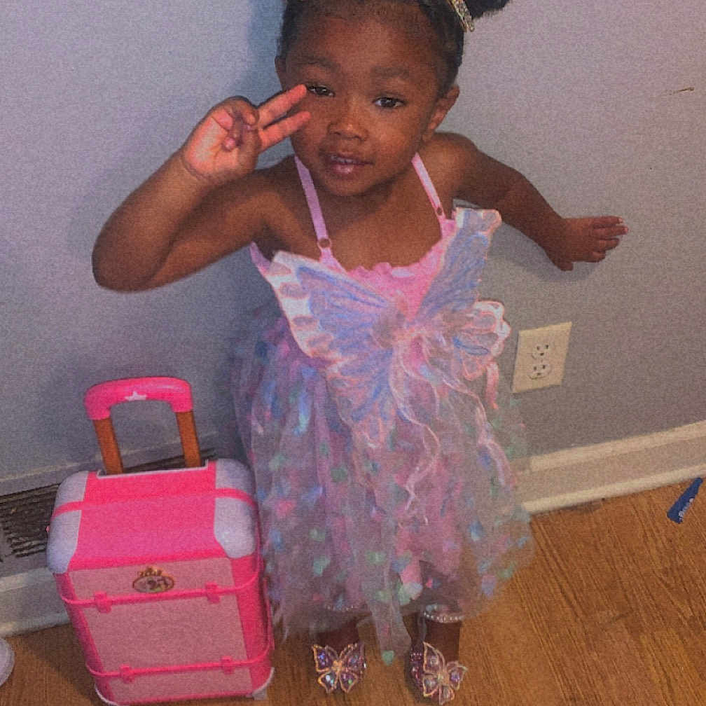 Kaorie joined the competition — help win amazing prizes! accessories, bag, baggage, box, child, clothing, door, dress, face, female, girl, hardwood, head, indoors, person, photography, portrait, purple, suitcase, wood