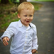 Tatum joined the competition — help win amazing prizes! toddler, child, blond_hair, white_shirt, shorts, smiling, outdoor, park, pathway, walking, happy, young_child, boy, casual_clothing, nature, daylight, playful, cute, portrait, person
